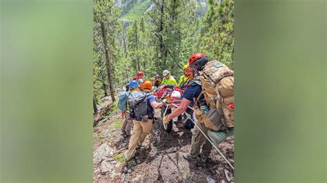 Hiker left on Colorado mountain by coworkers stranded overnight .